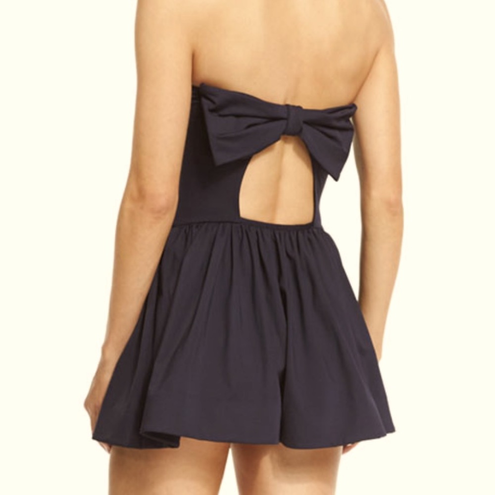 Kate Spade black swimsuit with sewn on skirt with bow on back